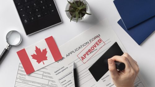 visa-application-composition-with-canadian-flag (1)